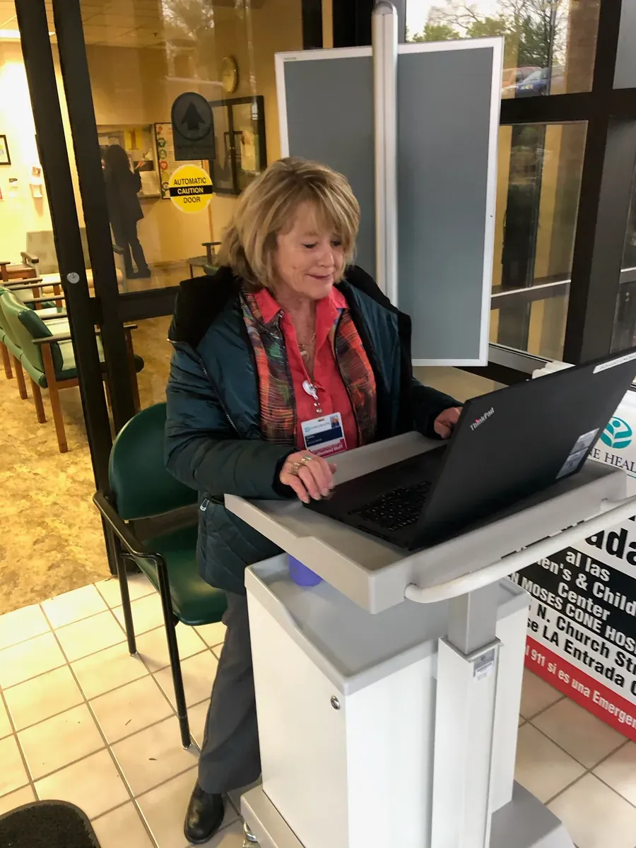 HealthPark staff member screening visitors at a hospital entrance